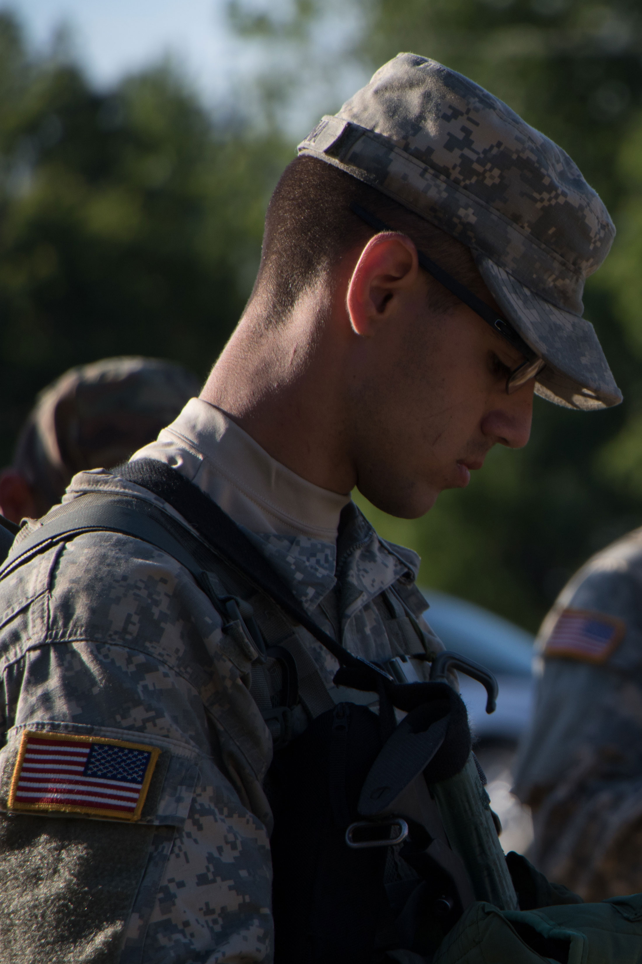 soldier looking down at notes 